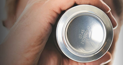 Domino F-Series Laser Date Codes on the Bottom of an Aluminum Soft Drink Can